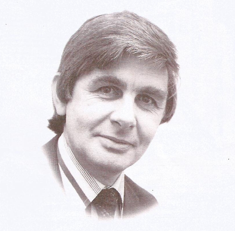 A sepia photograph of a young white man smiling