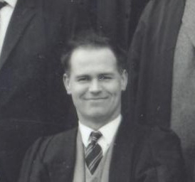 Black and white photograph of white male, roughly 30 years old, teacher. This photograph is a detail of a staff photograph from Guisborough Grammar School